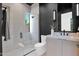 Modern bathroom with sleek, glass-enclosed shower and floating vanity at 4704 N 40Th Pl, Phoenix, AZ 85018