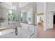 Modern bathroom features glass shower, wood cabinets, and a view to the bedroom at 4704 N 40Th Pl, Phoenix, AZ 85018