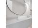 Modern bathroom featuring round mirror, vessel sink, and marble countertop at 4704 N 40Th Pl, Phoenix, AZ 85018