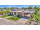 Modern home featuring a covered driveway and professionally landscaped front yard in a suburban neighborhood at 4704 N 40Th Pl, Phoenix, AZ 85018
