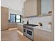 Well-appointed kitchen featuring a Wolf range, custom cabinetry, and designer finishes at 4704 N 40Th Pl, Phoenix, AZ 85018