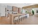 Kitchen with island and breakfast bar offering seating for eight and sleek wood cabinetry at 4704 N 40Th Pl, Phoenix, AZ 85018