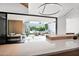 Bright, modern kitchen featuring an island with stone countertop and views of the backyard, pool, and outdoor seating at 4704 N 40Th Pl, Phoenix, AZ 85018