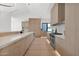Modern kitchen featuring a spacious layout, light wood cabinets, and state-of-the-art Wolf appliances at 4704 N 40Th Pl, Phoenix, AZ 85018