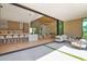 The open-concept design seamlessly blends indoor and outdoor living with stone fireplace and modern furnishings at 4704 N 40Th Pl, Phoenix, AZ 85018