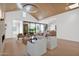 Living room with modern furnishings, wood floors, a fireplace, and a wall of windows overlooking the yard at 4704 N 40Th Pl, Phoenix, AZ 85018