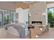 Bright living room with a stone fireplace, light wood floors, and clerestory windows at 4704 N 40Th Pl, Phoenix, AZ 85018