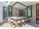 Outdoor bar with seating and a modern sink featuring a window into the kitchen at 4704 N 40Th Pl, Phoenix, AZ 85018