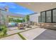Elegant outdoor patio with a grill, bar, and a comfortable seating area overlooking the pool at 4704 N 40Th Pl, Phoenix, AZ 85018