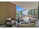 Inviting covered patio with comfortable seating, outdoor kitchen, and lush landscaping at 4704 N 40Th Pl, Phoenix, AZ 85018
