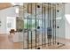 Close up of glass wine cellar with views into the living room and dining room at 4704 N 40Th Pl, Phoenix, AZ 85018