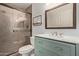 Bathroom showcasing a glass door shower and a modern vanity with drawers at 4842 E Kachina Trl # 3, Phoenix, AZ 85044