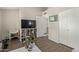 Cozy living room features a built-in bookcase, neutral paint, and wood-look floors at 4842 E Kachina Trl # 3, Phoenix, AZ 85044