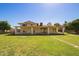 Expansive backyard with covered patio, lush lawn, and stepping stone path at 5226 W Tierra Buena Ln, Glendale, AZ 85306