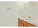 Cozy bathroom featuring wood vanity and tiled countertops with sink at 5226 W Tierra Buena Ln, Glendale, AZ 85306