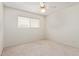 Carpeted bedroom with a window for natural light at 5226 W Tierra Buena Ln, Glendale, AZ 85306