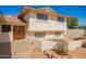 Inviting home exterior highlighting a wood front door and landscaped garden area at 5226 W Tierra Buena Ln, Glendale, AZ 85306