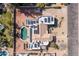 Bird's-eye view of a modern home with a private pool, solar panels, and a desert landscape at 5345 E Mercer Ln, Scottsdale, AZ 85254