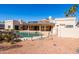 An entertainer's backyard featuring a pebble ground cover, pool, and private patio at 5345 E Mercer Ln, Scottsdale, AZ 85254