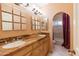 Elegant bathroom features marble countertop, double sinks, decorative mirrors, and tiled shower at 5345 E Mercer Ln, Scottsdale, AZ 85254