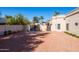 The home features a neutral color scheme, private gates, and desert landscaping at 5345 E Mercer Ln, Scottsdale, AZ 85254