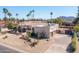 Desert landscaping and three-car garage highlight this single-story home in a lush, palm-lined neighborhood at 5345 E Mercer Ln, Scottsdale, AZ 85254