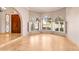 Foyer with travertine floors, a stained glass window and a decorative wood door at 5345 E Mercer Ln, Scottsdale, AZ 85254