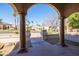 Arched front entrance with double doors and decorative columns. A stone walkway guides to the property at 5345 E Mercer Ln, Scottsdale, AZ 85254