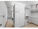 A walk-in closet with rods, shelves, cabinets and drawers, offering ample storage and organization solutions at 5345 E Mercer Ln, Scottsdale, AZ 85254