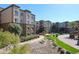 Beautiful view of the multi-story apartment complex and courtyard landscape in a well-maintained community at 5350 E Deer Valley Dr # 2246, Phoenix, AZ 85054