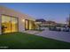 Modern backyard featuring a luxurious patio, glass-walled rooms, and mountain views at 5910 N 45Th St, Phoenix, AZ 85018