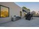 Outdoor kitchen with stainless steel grill and staircase in modern backyard at 5910 N 45Th St, Phoenix, AZ 85018