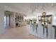 Contemporary bar area with sleek cabinetry, wine fridge, and open flow to living and dining spaces at 5910 N 45Th St, Phoenix, AZ 85018