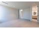 Bedroom with tile flooring, light paint and view to a bathroom at 5910 N 45Th St, Phoenix, AZ 85018