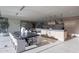 Dining area with large table, upholstered chairs, and view of the kitchen and the outside pool at 5910 N 45Th St, Phoenix, AZ 85018