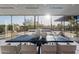 Dining room table surrounded by chairs with a view of the outside through expansive windows at 5910 N 45Th St, Phoenix, AZ 85018