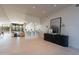 Elegant entryway with a designer console table, artwork, decorative screen, and open view to living areas at 5910 N 45Th St, Phoenix, AZ 85018