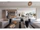 Bright and airy living room with sleek furniture, an adjacent bar, and a seamless transition to the outdoors at 5910 N 45Th St, Phoenix, AZ 85018