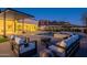 Chic outdoor seating area with a fire pit and pool, showcasing modern design and mountain views at 5910 N 45Th St, Phoenix, AZ 85018