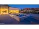 Modern pool and spa featuring stone accents and seamless transition to indoor living spaces at 5910 N 45Th St, Phoenix, AZ 85018