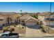 Aerial view of a single-Gathering home with desert landscaping, complemented by a clear blue sky at 661 E Redondo Dr, Gilbert, AZ 85296