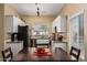 Bright kitchen featuring white cabinetry, granite counters, and a view to the outside at 661 E Redondo Dr, Gilbert, AZ 85296