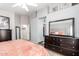 Bedroom featuring a tall dresser, mirror and carpet at 661 E Redondo Dr, Gilbert, AZ 85296