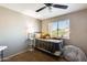 Bedroom with ceiling fan, natural light, and gray walls at 6938 W Wescott Dr, Glendale, AZ 85308