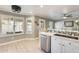 Bright kitchen view with stainless steel appliances, and seamless flow to dining area at 6938 W Wescott Dr, Glendale, AZ 85308