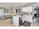 Open kitchen view with stainless steel appliances, sleek countertops, and seamless flow to dining area at 6938 W Wescott Dr, Glendale, AZ 85308