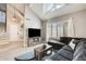 Bright and airy living room with vaulted ceilings, skylight, and modern finishes at 6938 W Wescott Dr, Glendale, AZ 85308