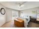 Main bedroom featuring a ceiling fan and glass patio doors to a private balcony at 6938 W Wescott Dr, Glendale, AZ 85308