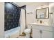 Bathroom features a shower-tub combo with designer tile, contemporary fixtures, and modern vanity at 7333 E Palm Ln, Scottsdale, AZ 85257