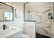 Modern bathroom features a glass-enclosed shower with elegant marble-style tiling and contemporary fixtures at 7333 E Palm Ln, Scottsdale, AZ 85257